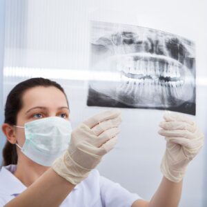 dentist looking at xray