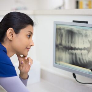 dentist looking at xray