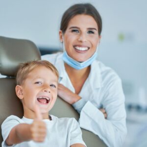 kid at dentist smiling