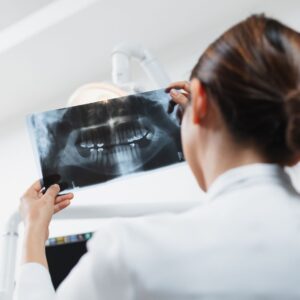 dentist looking at xray