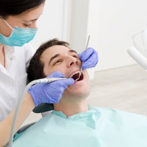 man getting teeth cleaned