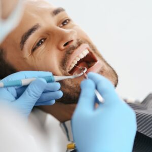 man getting his teeth cleaned