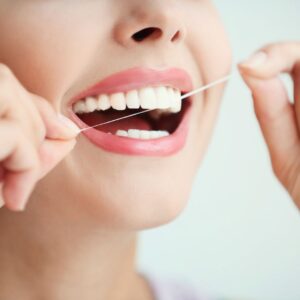 person flossing