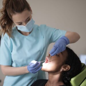 woman getting tooth cleaning