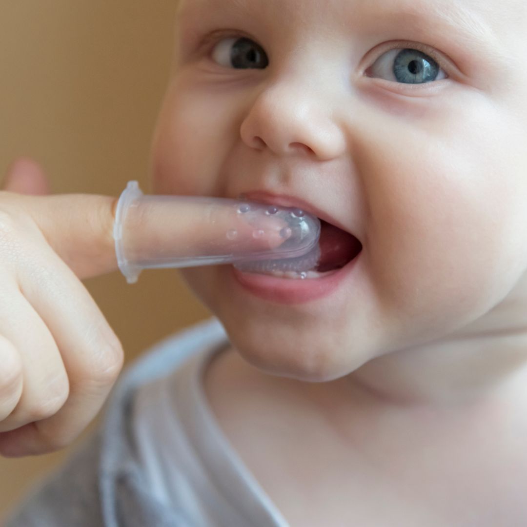 brushing an infant's teeth