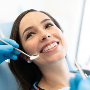A women smiling at her dentist 