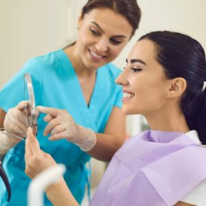 showing a patient their teeth