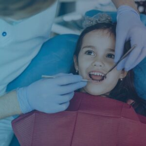 girl getting teeth cleaned