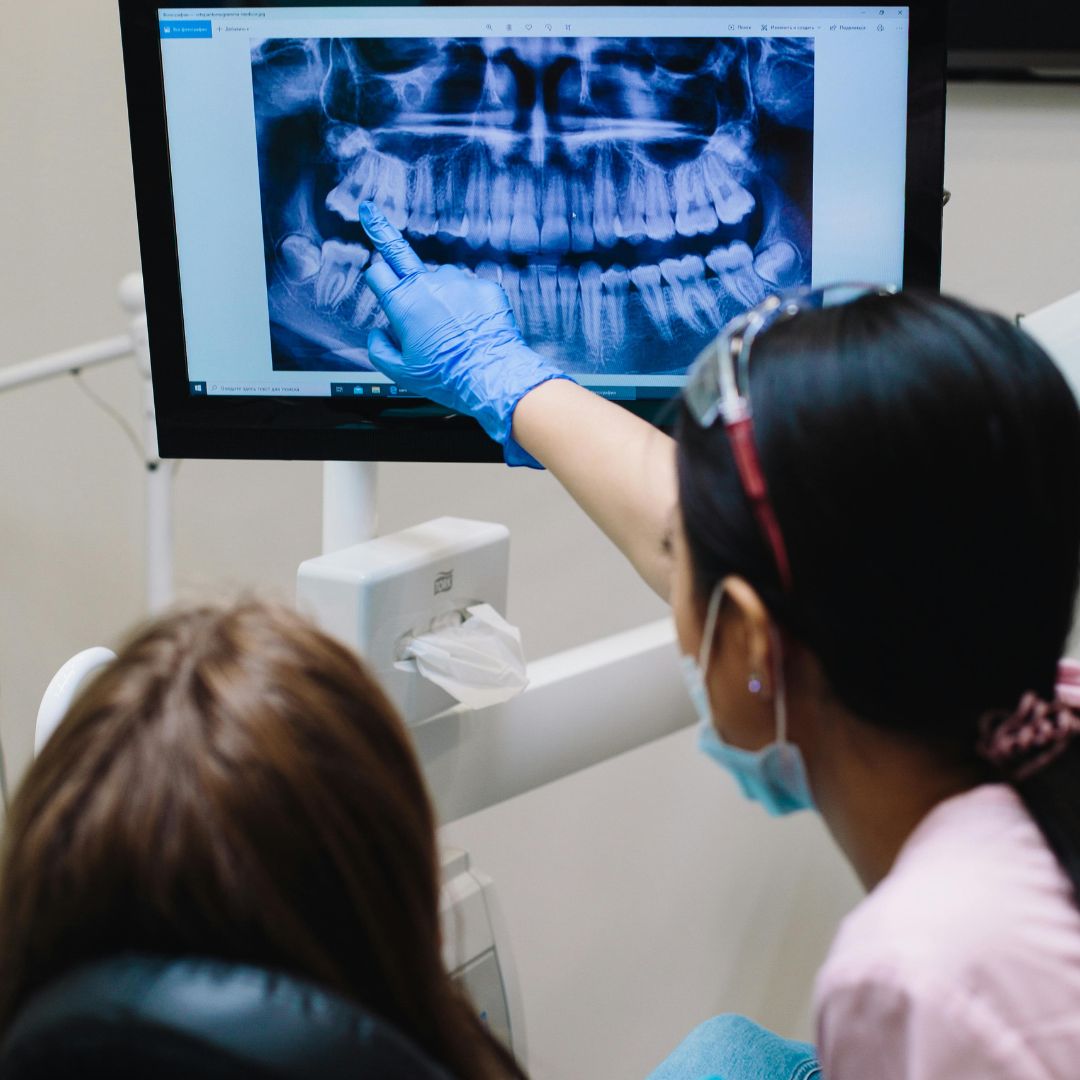 patient looking at dental x-rays