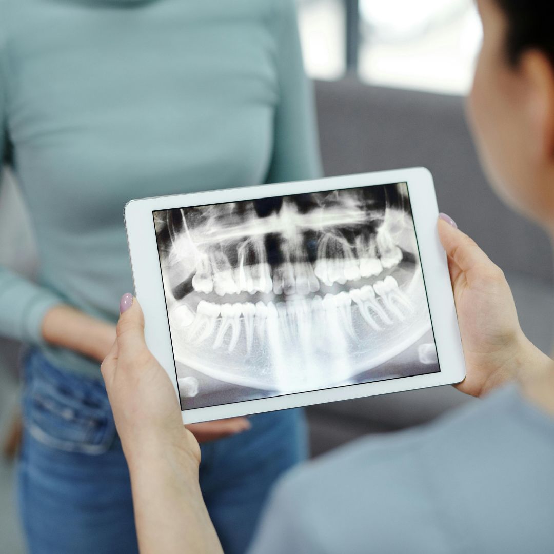 dentist looking at x-rays