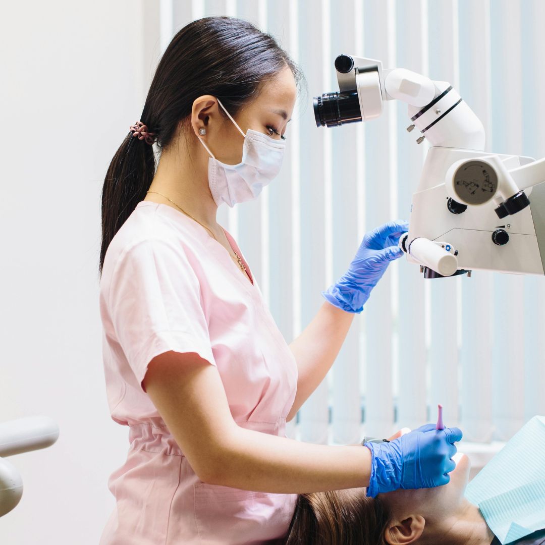 dental assistant giving patient x-ray